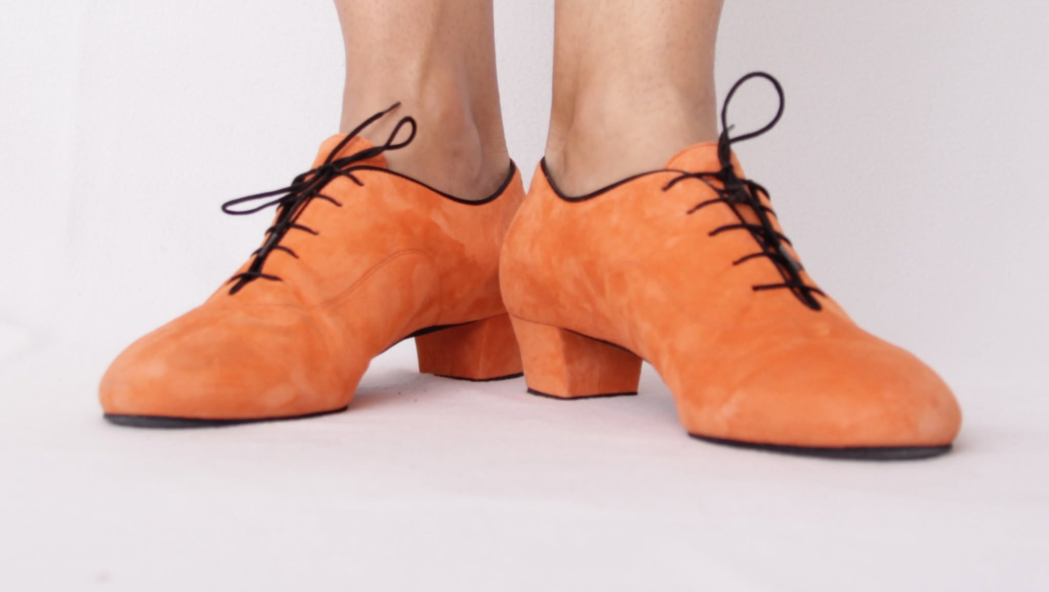 Side view of custom orange suede men's dance shoes