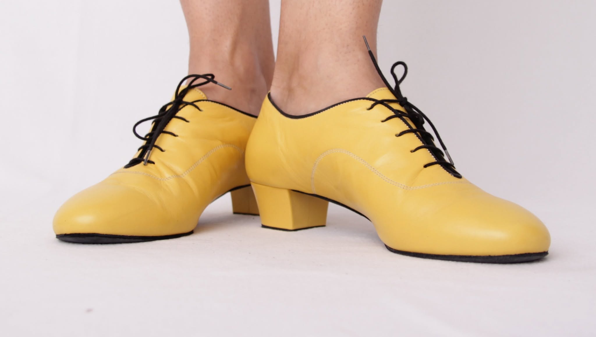 Side view of custom yellow suede men's dance shoes
